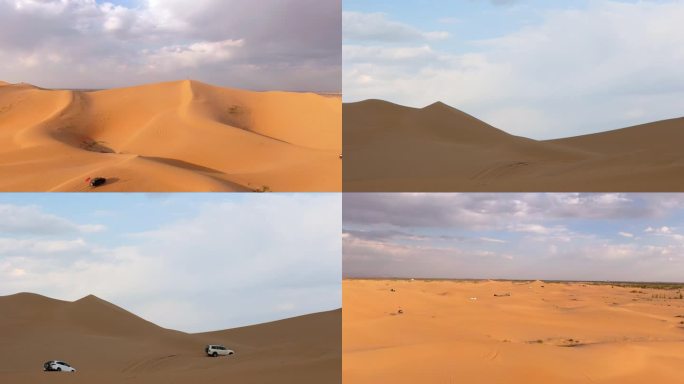 航拍行驶在沙漠的汽车越野车