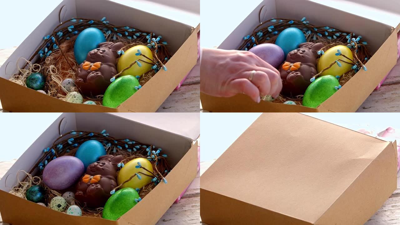女人用手打开装有彩色彩蛋的快乐复活节贺礼盒。