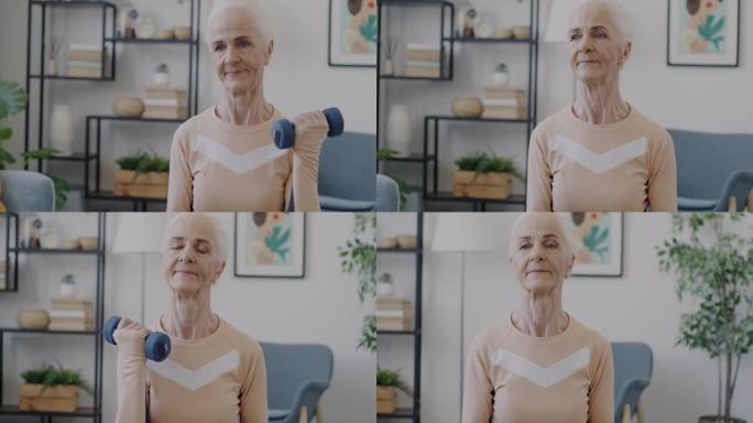健康的老年妇女在家里独自训练哑铃进行运动的肖像
