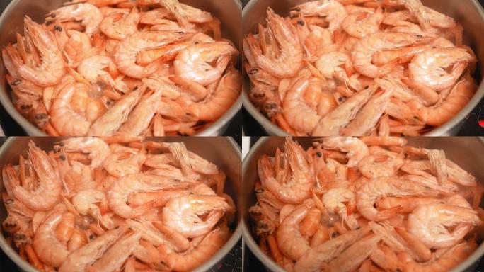很多虾在锅里油炸。加工烹饪虾。概念烹饪和海鲜