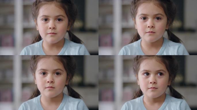 肖像美丽的小女孩看着相机可爱的孩子表情严肃享受快乐的童年4k
