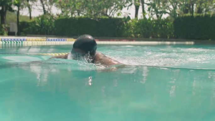 黑人游泳运动员在户外游泳池训练