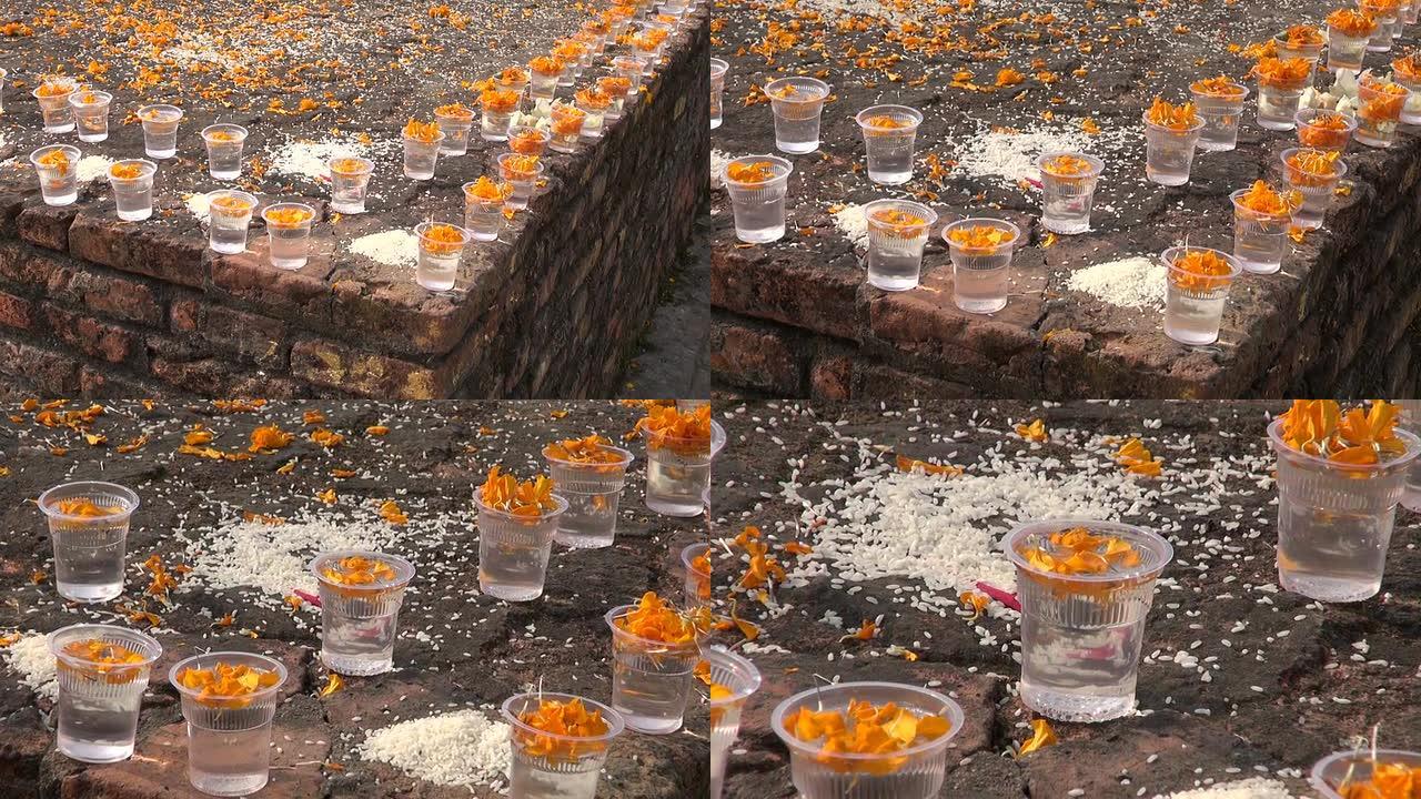 佛教祈祷在尼泊尔神圣的地方提供食物和鲜花
