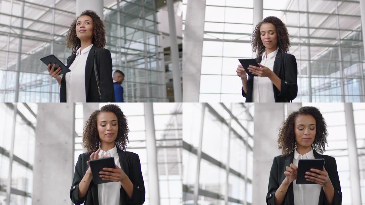 美丽的女商人在机场用平板电脑发短信走在公司办公楼检查电子邮件信息在线成功的女高管在工作4k