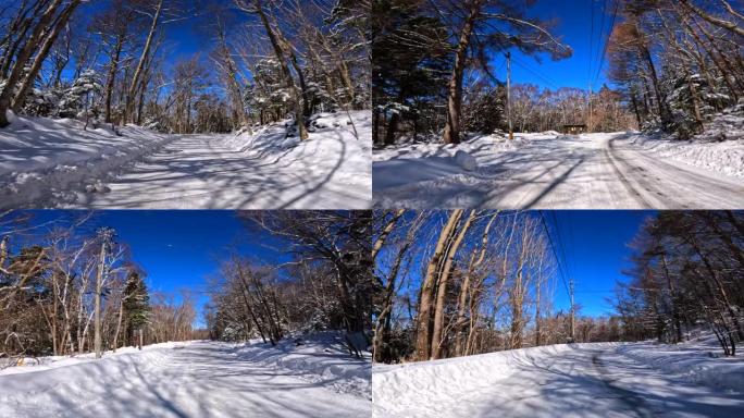 在冬季山区积雪覆盖的道路上行驶