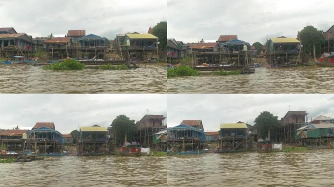 在柬埔寨从船上拍摄的洞里萨湖边缘的高跷上的房子