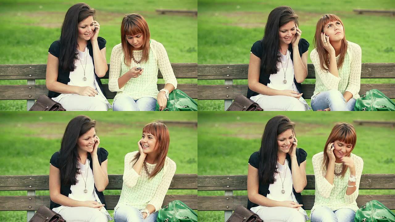 高清: 两名年轻女子拿着手机