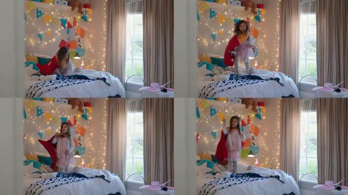 快乐的小女孩穿着戏服跳上床在家里五颜六色的卧室里玩游戏享受嬉戏的想象力