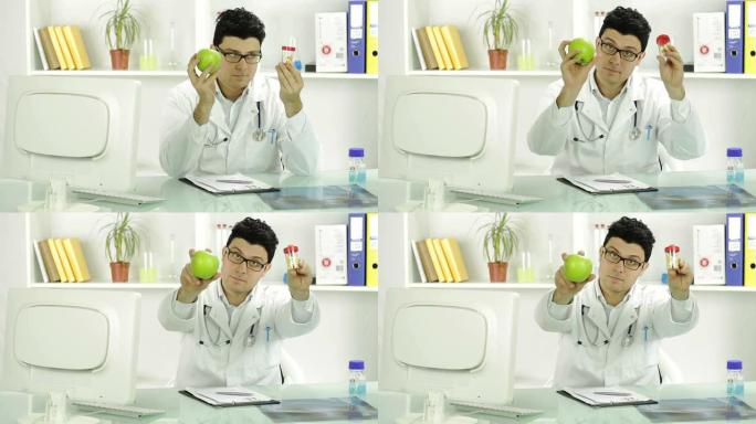 年轻医生持有苹果和药丸水果医学概念