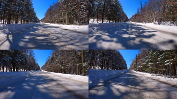 冬季在多雪山区的森林道路上行驶