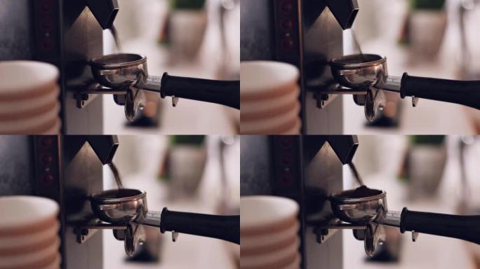 咖啡机，咖啡师手和咖啡豆在咖啡馆里磨碎，特写镜头并准备拿铁或浓缩咖啡饮料。热饮料，在餐厅和酿造过程中