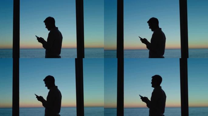 年轻人在酒店房间里使用智能手机发短信，在社交媒体上分享度假生活方式，享受日落时的海景