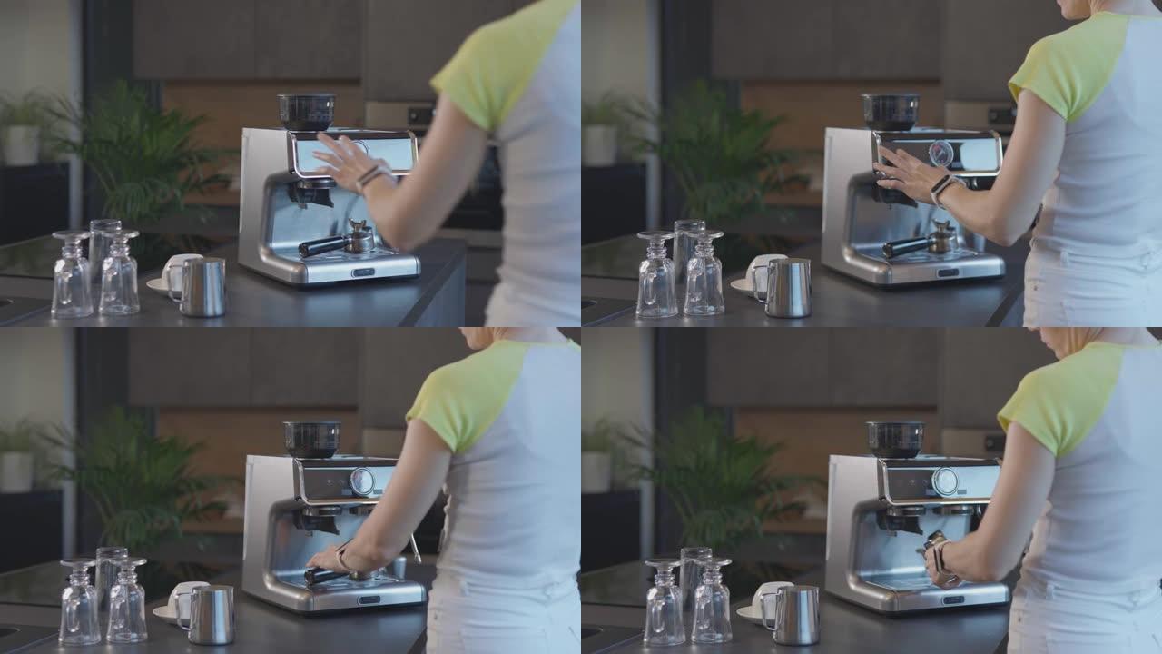 高加索女性启动浓缩咖啡机并使用portafilter。