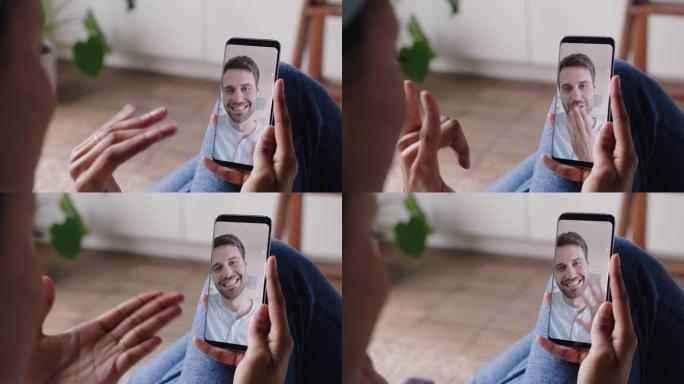 使用智能手机与聋哑男友视频聊天的年轻女子使用手语手势交流享受在线交流