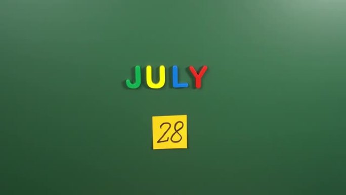 7月28日日历日用手在学校董事会上贴一张贴纸。28 7月日期。7月第二十八天。第28个日期号。28天