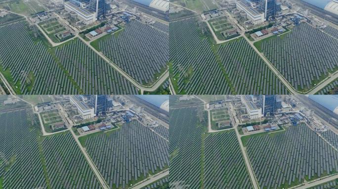工厂附近太阳能电池板农场的鸟瞰图