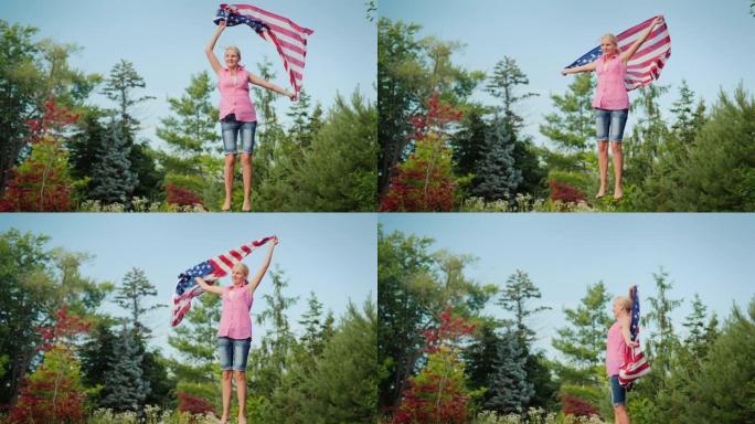 有魅力的女人与美国国旗在蹦床上跳在她的后院