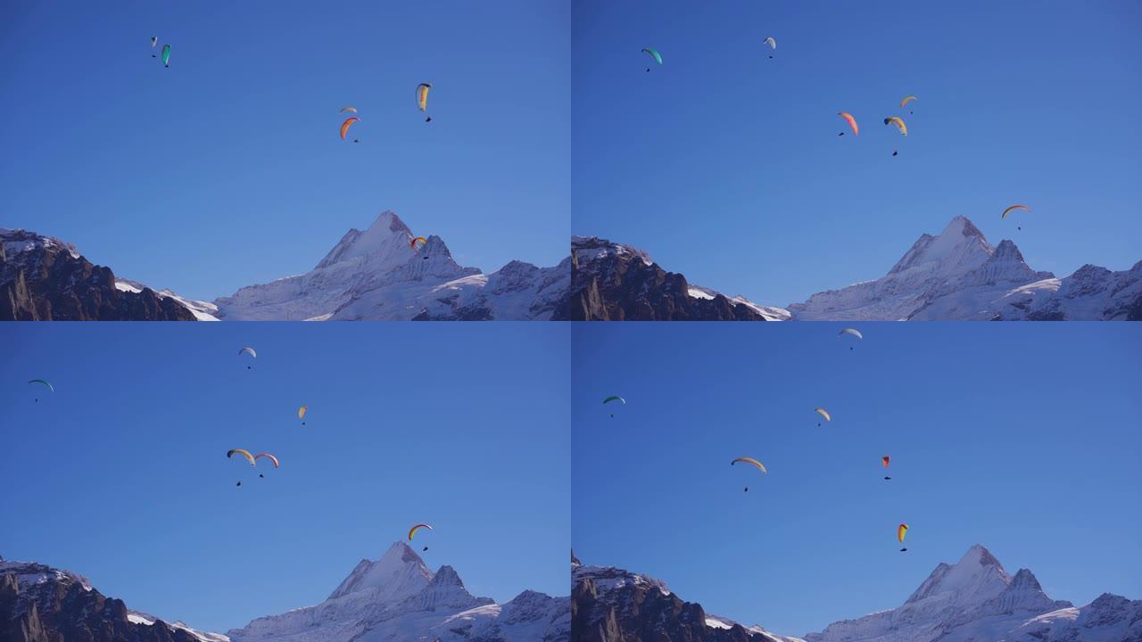 在蓝天的群山上滑翔伞