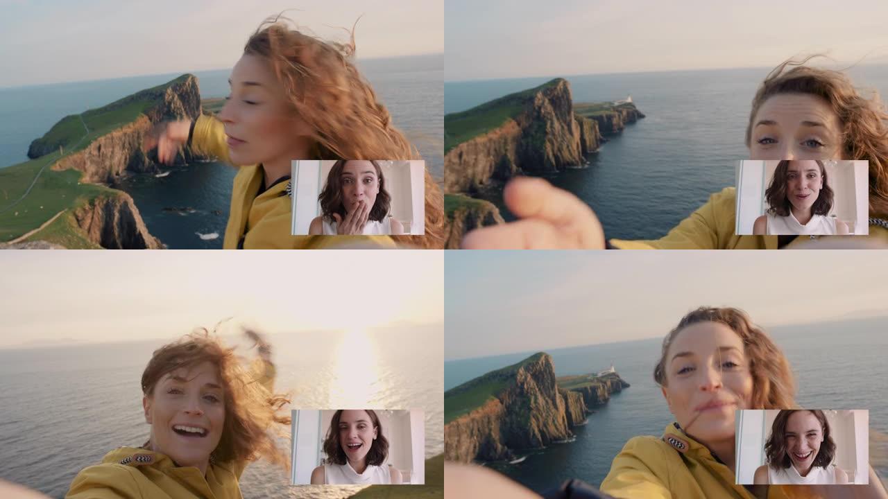快乐旅行女人视频聊天与最好的朋友吹吻分享在苏格兰度假，玩得开心展示海洋和挥手