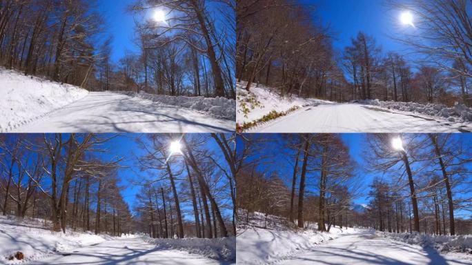 在冬季山区积雪覆盖的道路上行驶