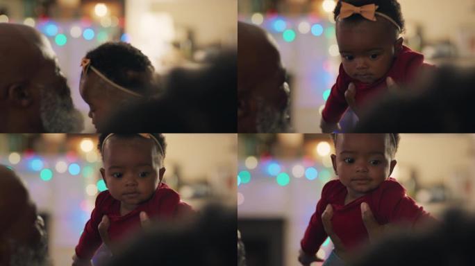 非裔美国人家庭圣诞祖父抱着女婴亲吻孙女骄傲快乐的祖父母在家享受节日团圆4k