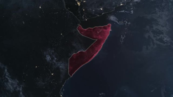 突出显示的索马里黑暗地图，通过4K照片真实动画地球从太空放大，全景包括非洲、西欧和美国。史诗旋转的世