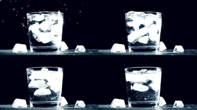冰立方在玻璃水中飞溅，隔离在黑色背景上。慢动作