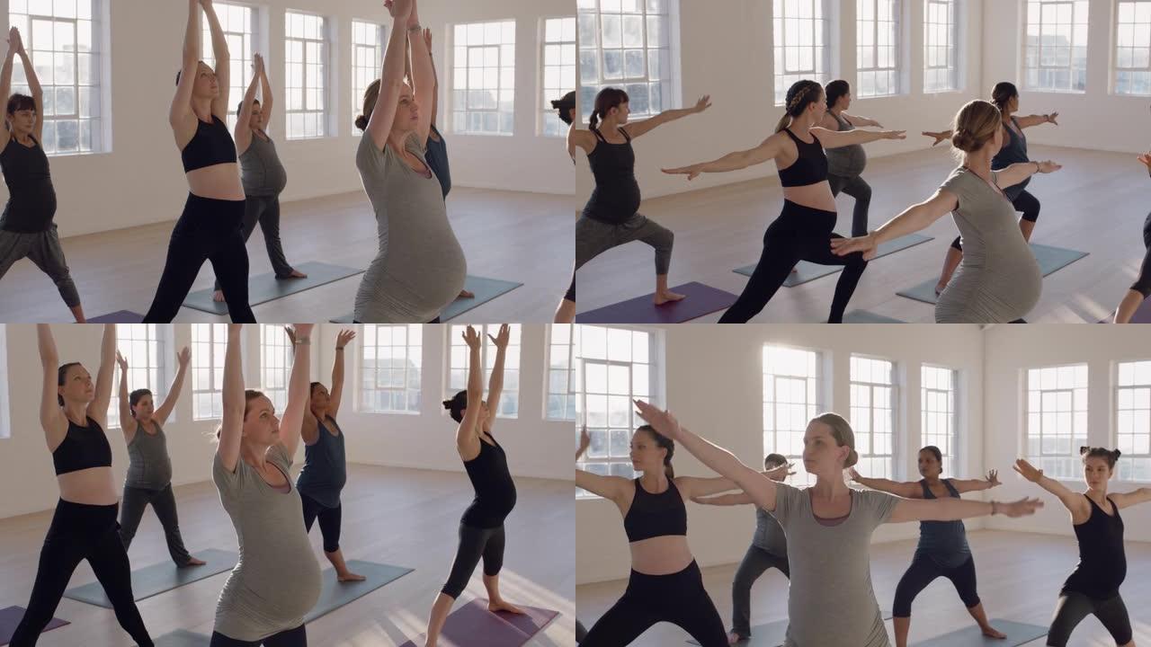 日出时在运动工作室练习战士姿势享受健康生活方式团体健身锻炼的年轻孕妇瑜伽课