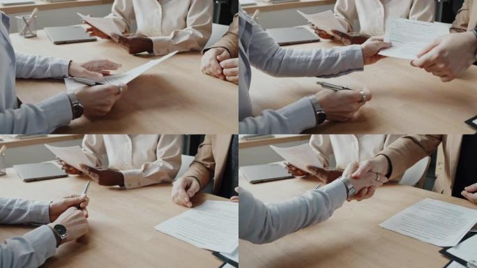 高加索申请人签署工作协议并与高加索人力资源部握手