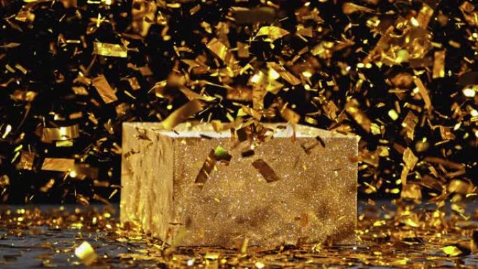 SLO MO LD闪亮的五彩纸屑落在闪闪发光的金色盒子上