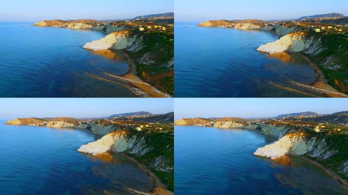 意大利西西里岛斯卡拉·德·图尔奇。在晴朗的天空下，美丽的海景拍摄了悬崖和海岸线的无人机