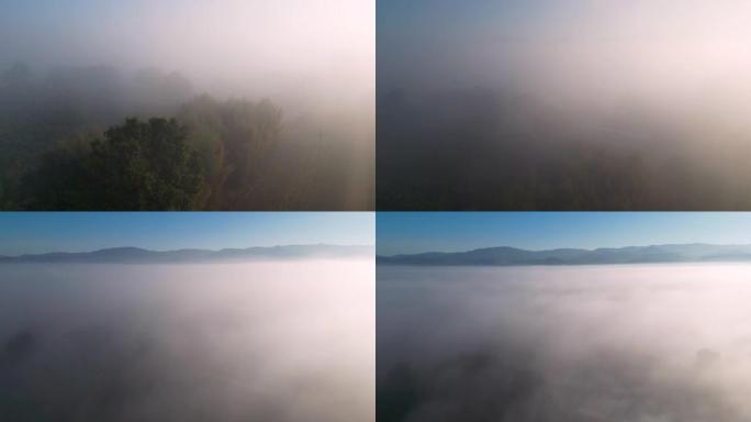空中拍摄云层和移动的薄雾与早晨的日出时间