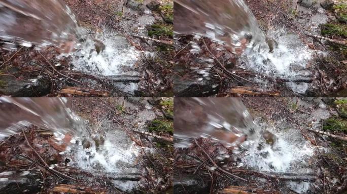 落叶林中的清澈瀑布慢动作，落水，自然体验