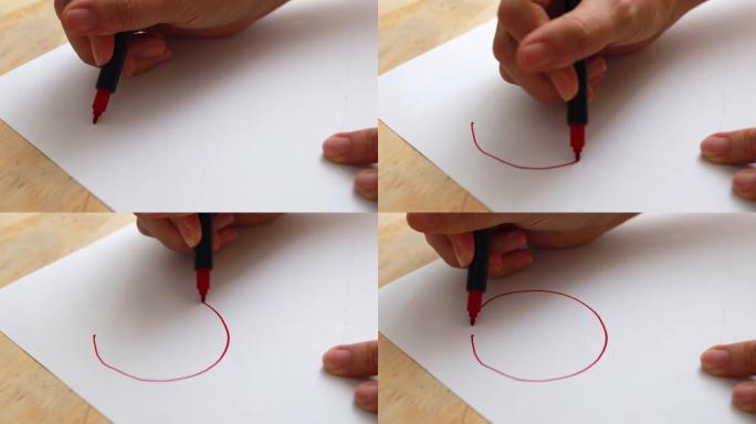 用红色记号笔在白色画纸上画红色圆圈。教育理念。