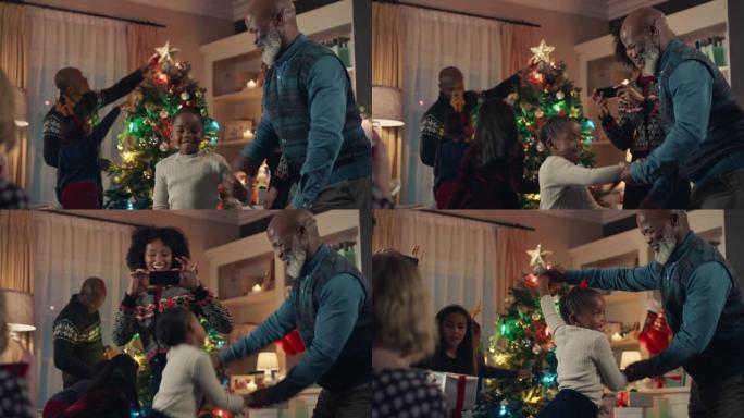 圣诞夜，非洲裔美国祖父和小女孩跳舞快乐的孩子和爷爷一起跳舞，享受家庭节日庆祝活动4k