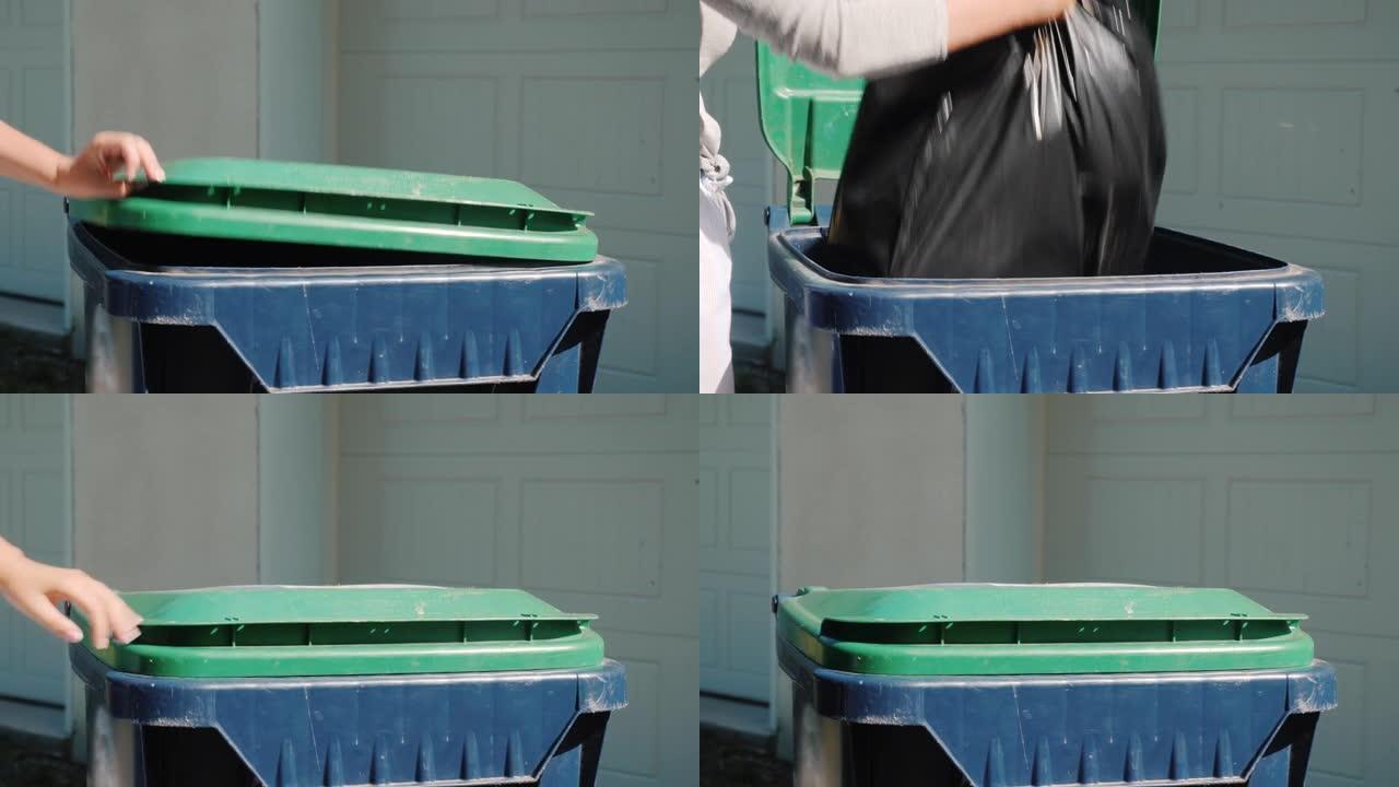 家庭主妇将一袋垃圾扔进房子附近的水箱