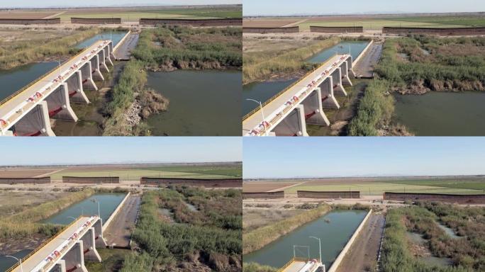 无人机捕捉到科罗拉多河流经亚利桑那州尤马和墨西哥阿尔戈多内斯的惊人镜头，展示了这条重要水道的美丽和力