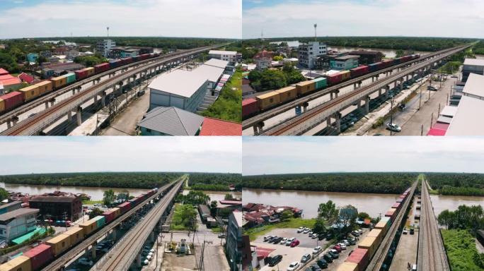 鸟瞰货运列车承运人集装箱到码头商业港口，商务物流进口出口运输或货运。