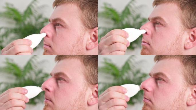 成年男性使用鼻喷剂来缓解流鼻涕。医学、健康的概念。
