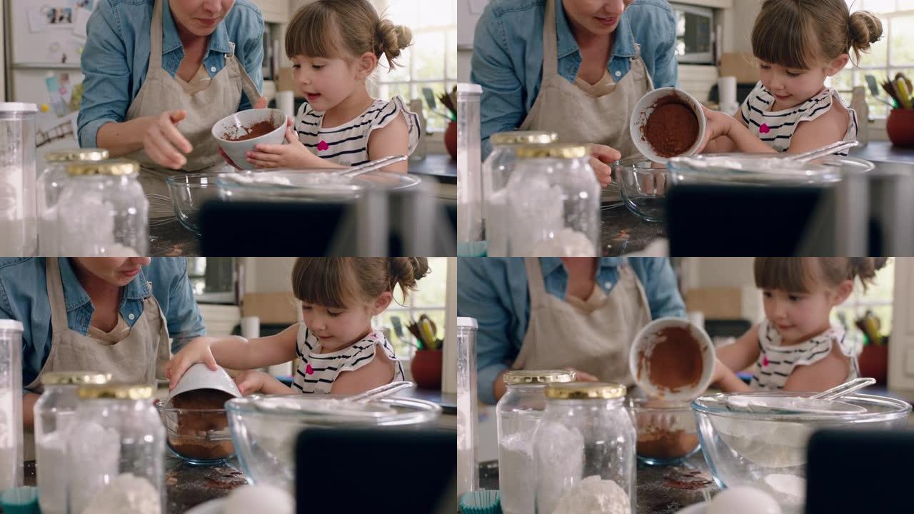 美丽的小女孩帮助妈妈在厨房里烘烤混合配料烘烤巧克力蛋糕在家准备食谱