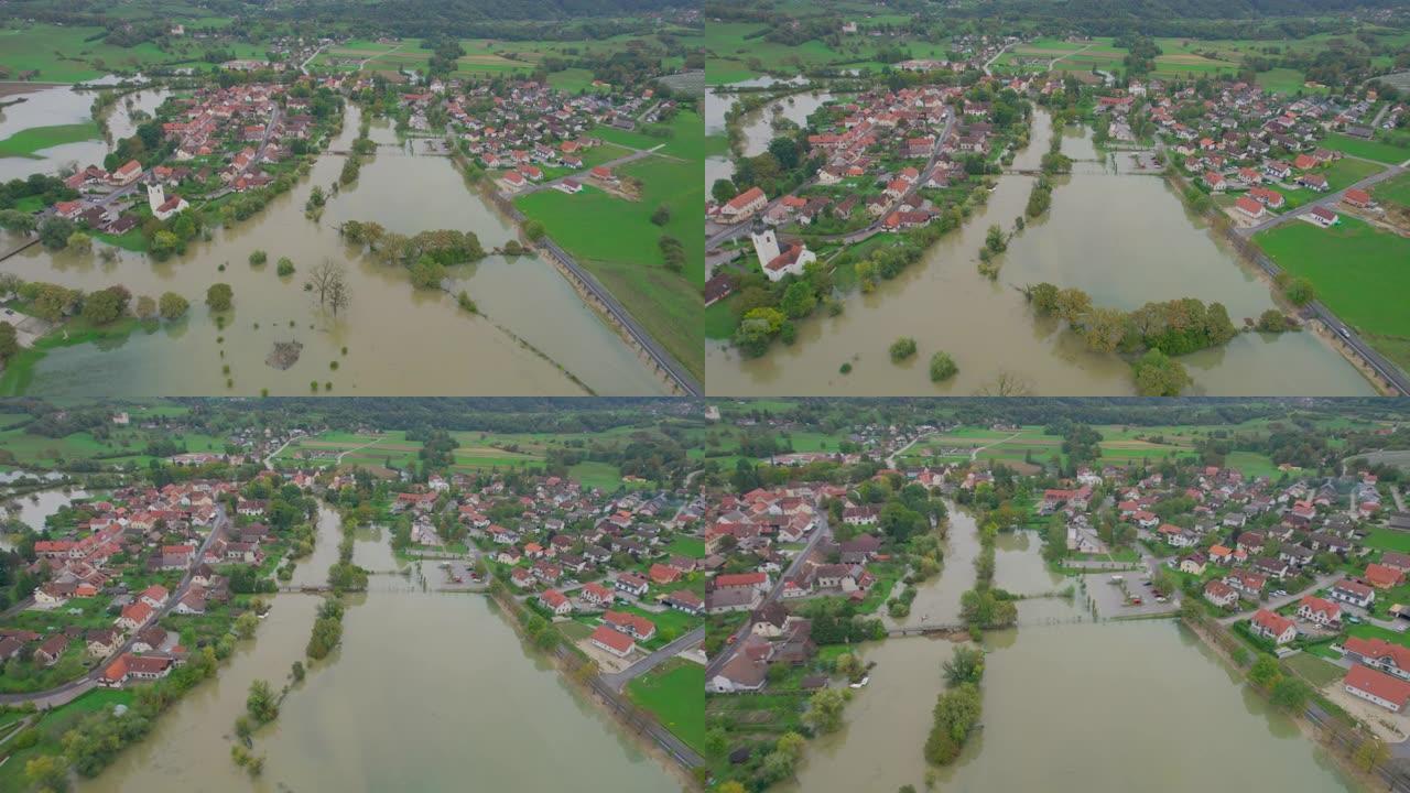 空中: 风景如画的村庄被洪水泛滥的河流包围