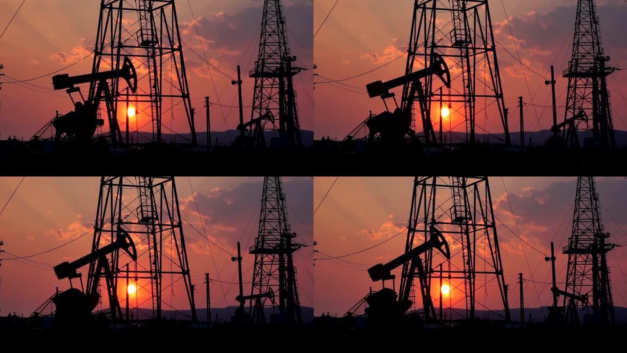 日落中的石油井架机构