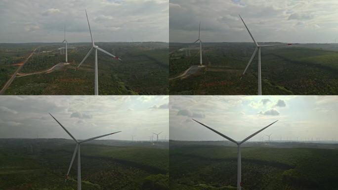 在风电场产生清洁可再生能源的风力涡轮机的航拍画面。