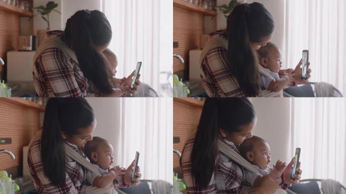 年轻的母亲和婴儿用智能手机与最好的朋友视频聊天，向蹒跚学步的快乐妈妈挥手，享受分享母亲的生活方式