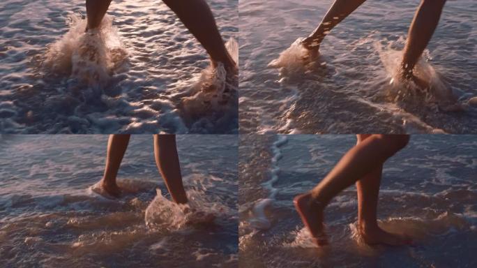 近距离的女人脚走在海滩上日落享受海浪轻轻飞溅暑假女游客