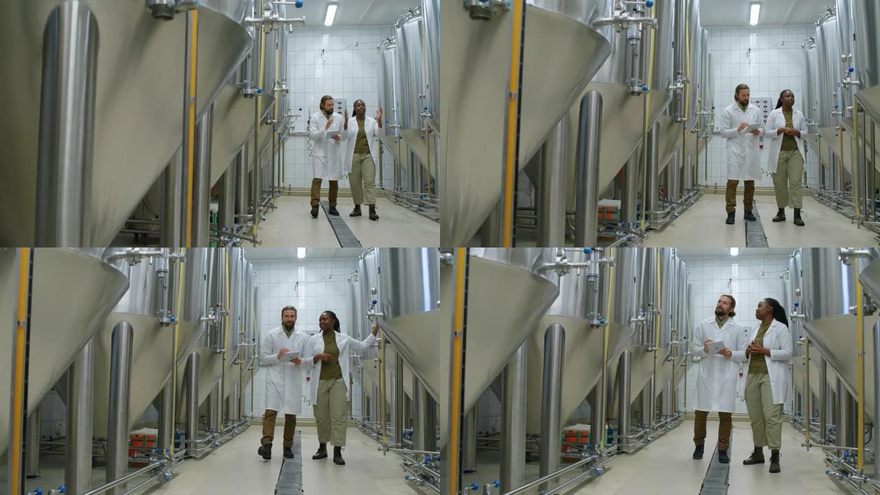 各种啤酒厂工人检查啤酒发酵罐