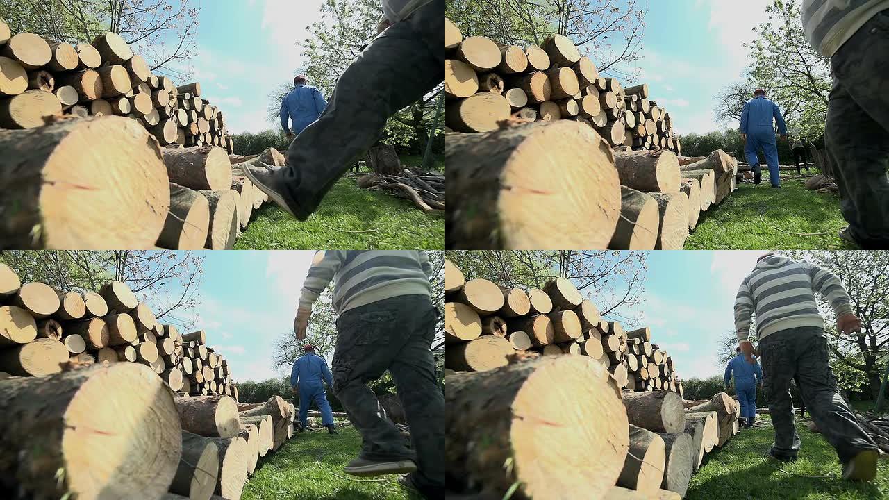 用腿在一堆木头上踢木头