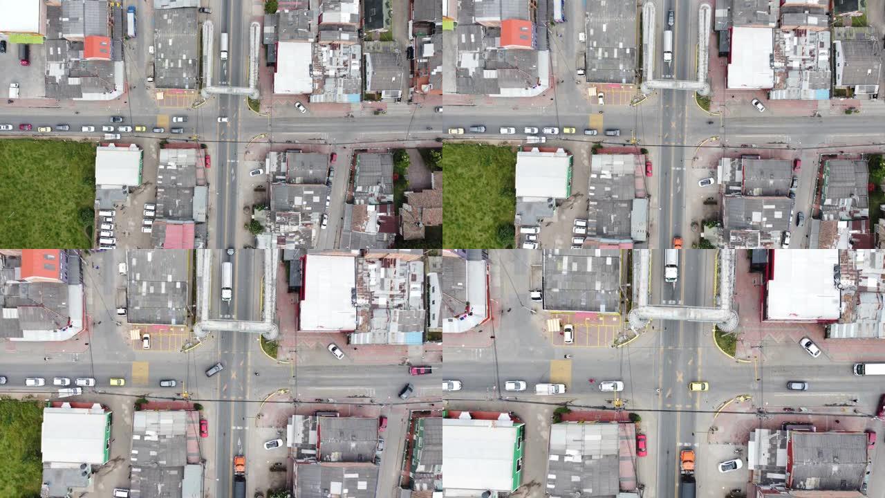 空中俯视图4k视频由建筑Cajica Cundinamarca，背景山公路公路汽车和卡车交通道路标记