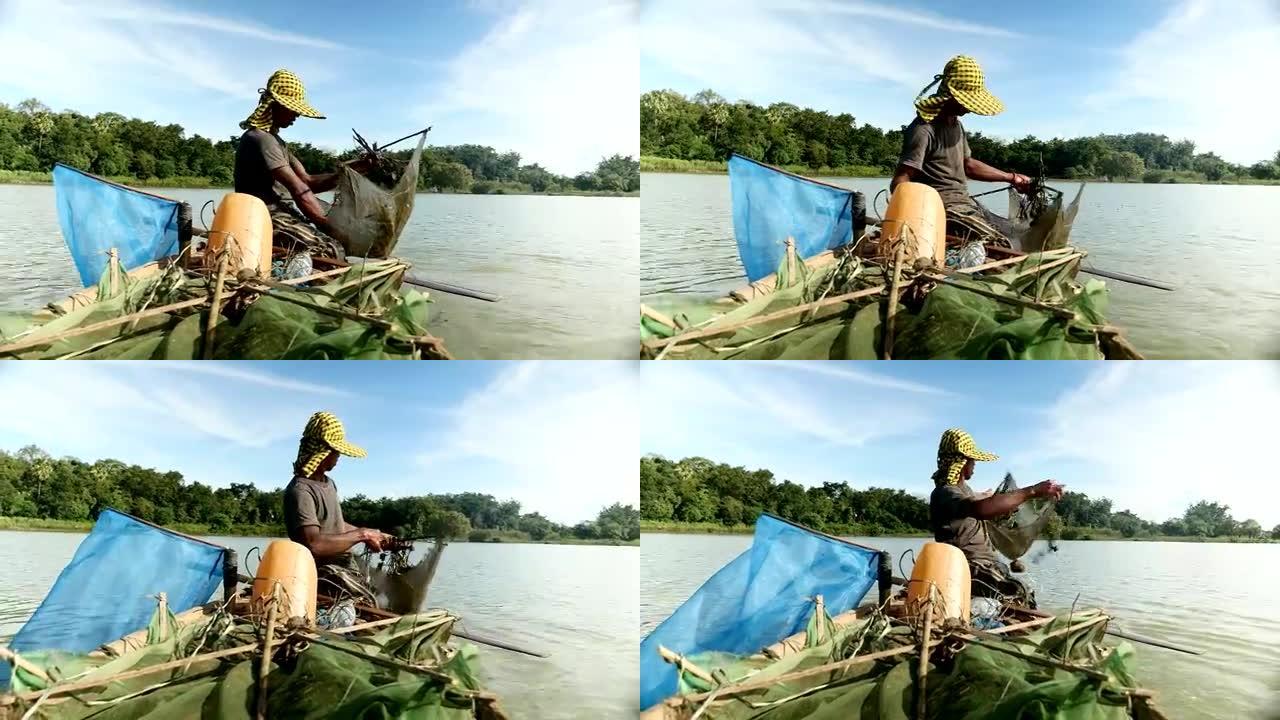 虾渔夫捕捉虾，诱饵网并将其推入河中