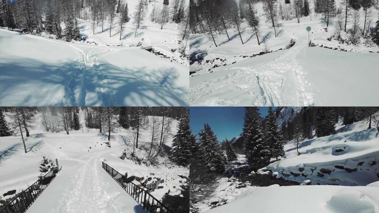 冬季在未触及的偏远山区的新鲜粉末雪上滑雪